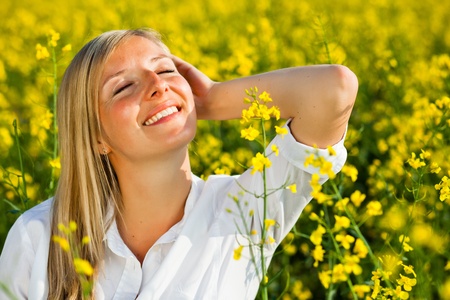 Caucasian woman in spring fieldの写真素材