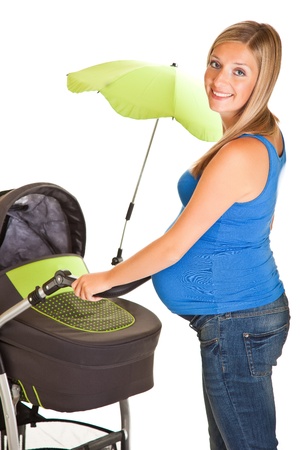 Pregnant woman with baby carriage isolated on whiteの写真素材