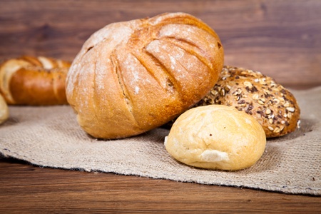 Composition of fresh bread on woodの写真素材