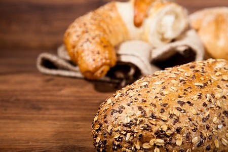 Composition of fresh bread on wood