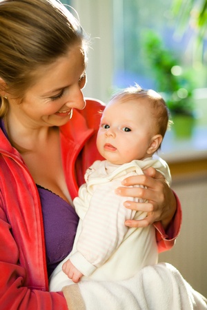 Mother holding beautiful baby girlの写真素材