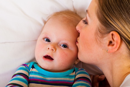 Mother with happy and cute infant baby girl 