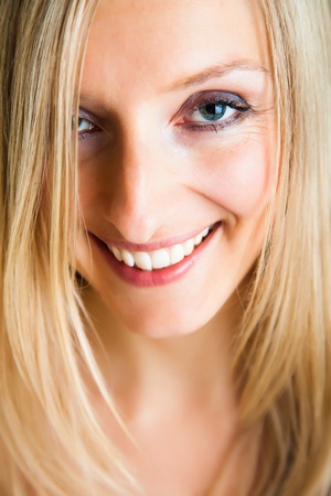 Blond woman in dress isolated on whiteの写真素材