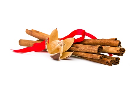 Composition of spices with cinnamon sticks isolated on white backgroundの写真素材