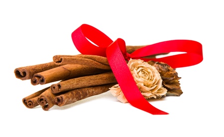 Composition of spices with cinnamon sticks isolated on white backgroundの写真素材