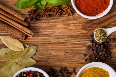Frame composition of spices on wood, anise,cinnamon,pepper, laurelの写真素材