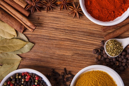 Frame composition of spices on wood, anise,cinnamon,pepper, laurelの写真素材