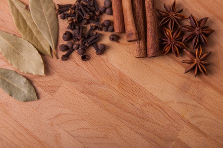 Frame composition of spices on wood, anise,cinnamon,pepper, laurelの写真素材