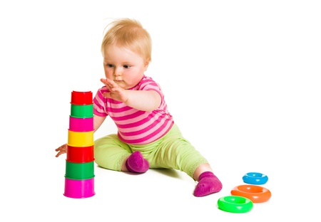 Infant playing and learning isolated on whiteの写真素材