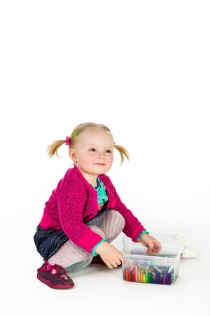 Infant baby girl drawing isolated on whiteの写真素材