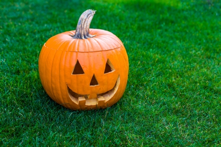 Jack-o-lantern on green grassの写真素材