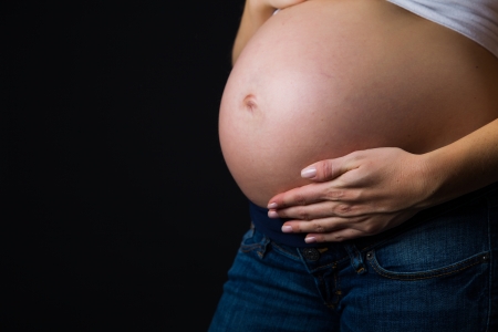 Pregnant woman isolated on whiteの写真素材