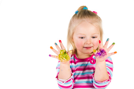 Child painting with fingers isolated on white の写真素材