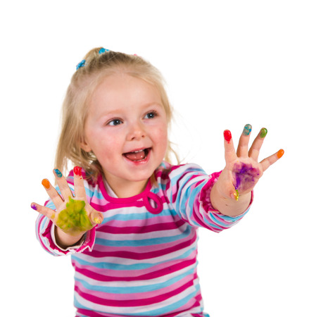 Child painting with fingers isolated on white の写真素材