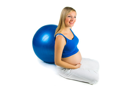 Pregnant woman isolated on whiteの写真素材