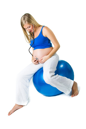 Pregnant woman isolated on whiteの写真素材