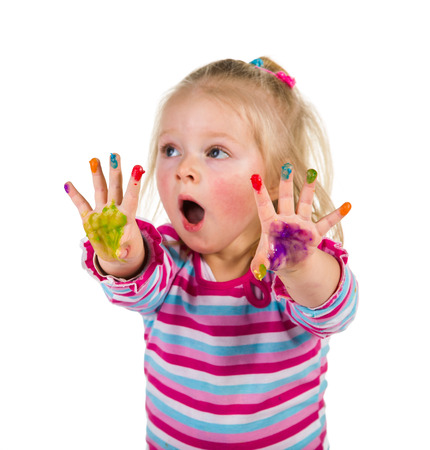 Child painting with fingers isolated on white の写真素材