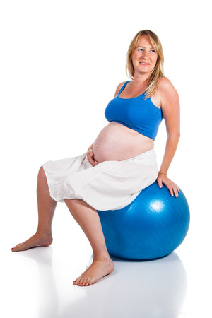 Pregnant woman with blue ballの写真素材
