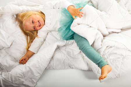 Cute and happy preschool blonde girlの写真素材