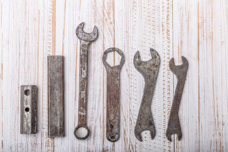 old pliers hand tool isolated on wood top viewのeditorial素材