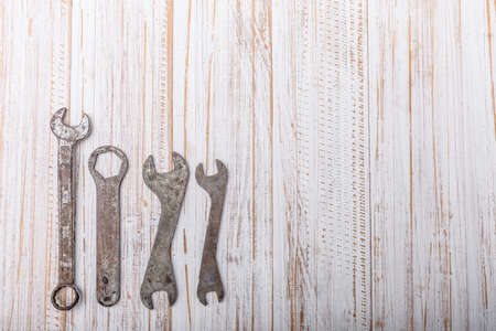 old pliers hand tool isolated on wood top viewのeditorial素材