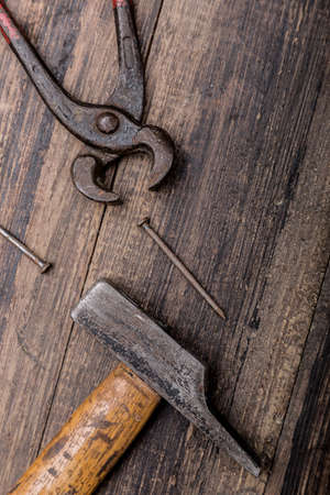 hammer tool nails on wood top viewのeditorial素材