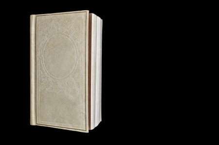 Blank book cover isolated on blackの写真素材