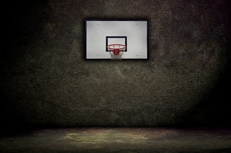 Basketball hoop on empty outdoor courtの写真素材
