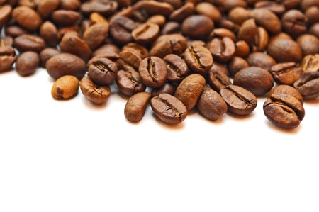 Brown roasted coffee beans isolated on white backgroundの写真素材