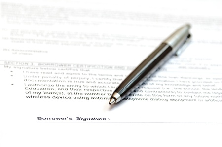 Concept of signing loan agreement with penの写真素材