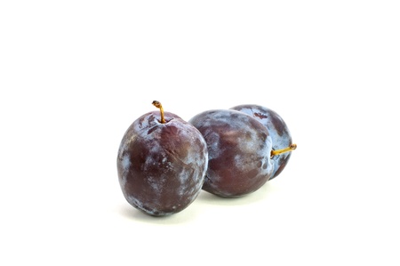 Fresh plums isolated on the white backgroundの写真素材