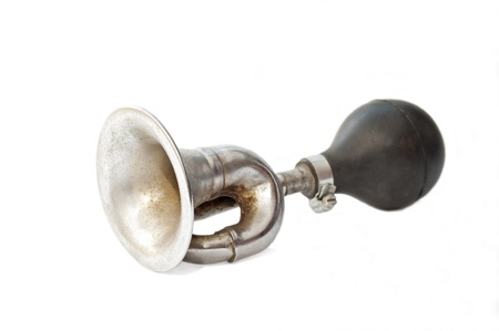 Old fashioned rusty bike horn isolated on white backgroundの写真素材