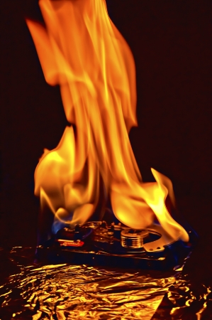 Computer hard disk on fire, burning in flasmesの写真素材