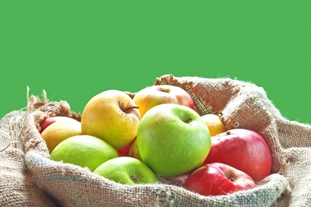 Fresh ripe apples on burlap bag from farm の写真素材