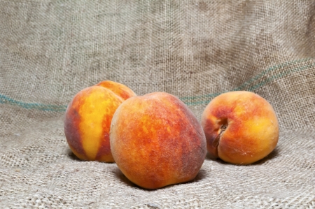 Tasty fresh ripe peaches on a tableの写真素材