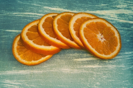 Sliced orange on grunge backgroundの写真素材