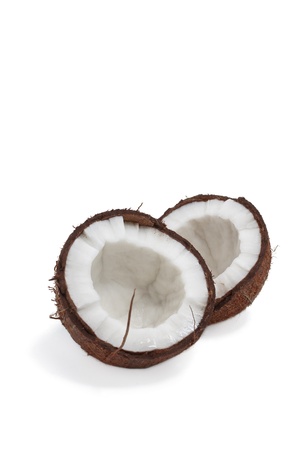 Two half of coconut isolated on white background with shadow  Coconut is tasty tropical fruit  の写真素材