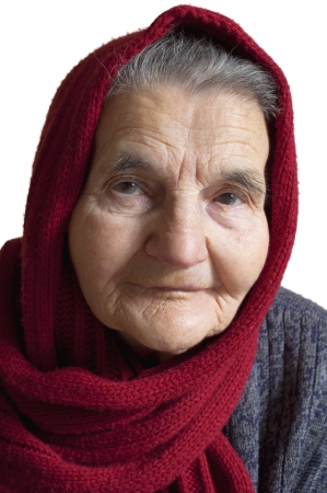 Portrait of an elderly woman with  red scarf on headの写真素材