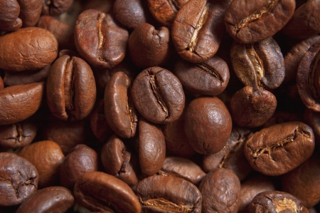 Closeup roasted coffee beans, can be used as a background の写真素材