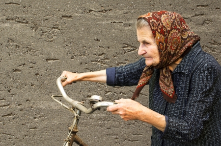 Active elderly woman with her bike の写真素材