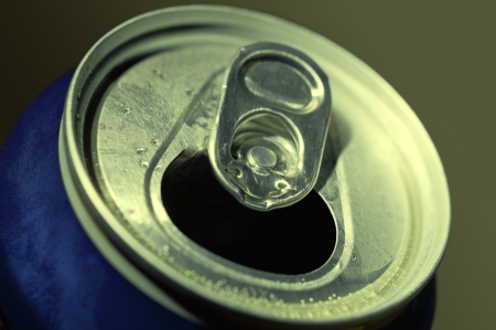 Aluminum beer can with water drops on dark background