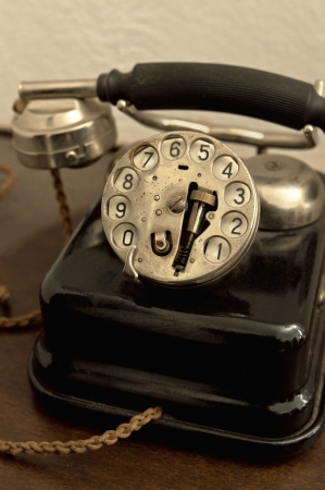 An old phone in dusty and rusty condition の写真素材