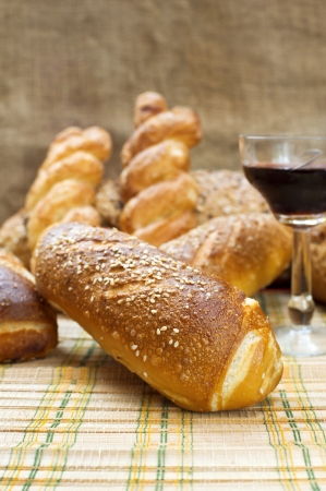 Still life assortment of bread with a glass of red wine  Selective focus with shallow depth of field の写真素材