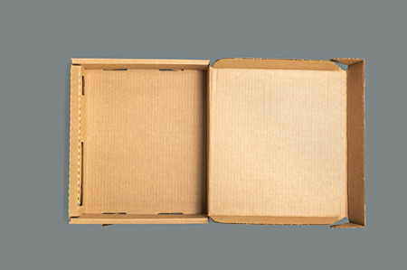 Empty shape box made of cardboard on dark background.