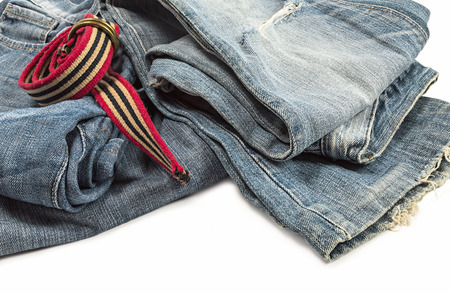 Blue jeans and belt on white background.の写真素材