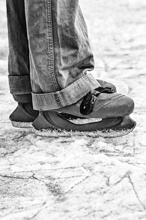 Wide skates on ice. Black and white imageの写真素材