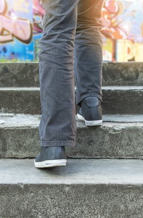 Person walking on stairs. Selective focus.の写真素材