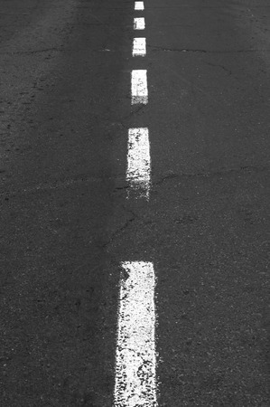White grunge line on asphalt road.の写真素材