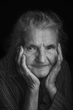 Portrait of a sad elderly woman. Selective focus.