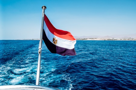 Egyptian flag flying at the stern pleasure boats . Red sea